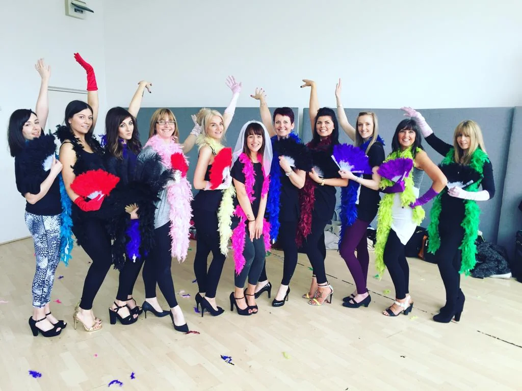 Burlesque hen party dance class Oxford group with feather boas